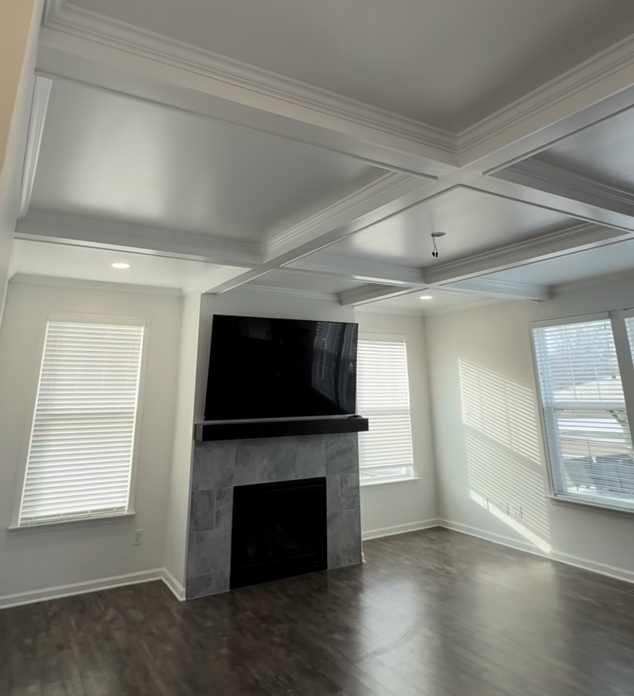 A coffered ceiling project that hit an unexpected water line turned into one of our best builds — smooth finish, recessed lighting, and a layout that looks original to the home. Here's how it came together.