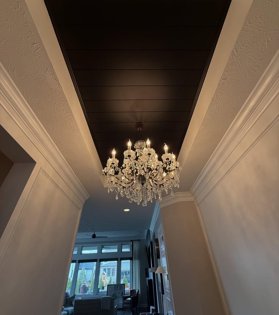 An entryway transformed with a black shiplap ceiling, custom picture frame molding, and wainscoting carried through the hallway at the right height. See how Radford Woodworks turned a Carmel, Indiana home into something truly unforgettable.