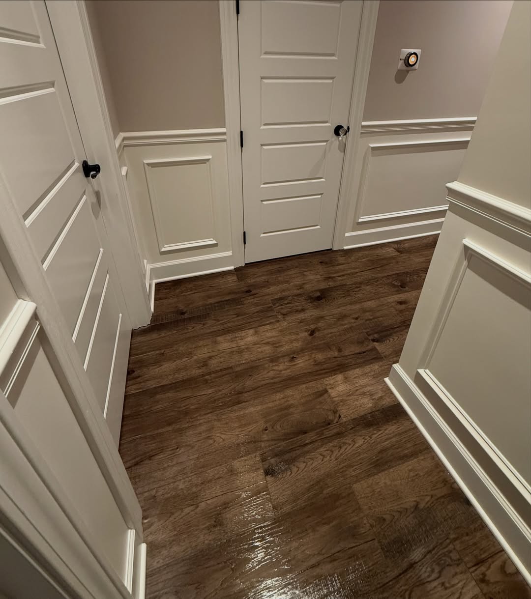 An entryway transformed with a black shiplap ceiling, custom picture frame molding, and wainscoting carried through the hallway at the right height. See how Radford Woodworks turned a Carmel, Indiana home into something truly unforgettable.