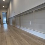 Accent wall design can turn a long blank walkway into one of the strongest features in a home with clean trim carpentry, balanced layout, professional painting, and custom finish work.