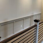 Accent wall design can turn a long blank walkway into one of the strongest features in a home with clean trim carpentry, balanced layout, professional painting, and custom finish work.