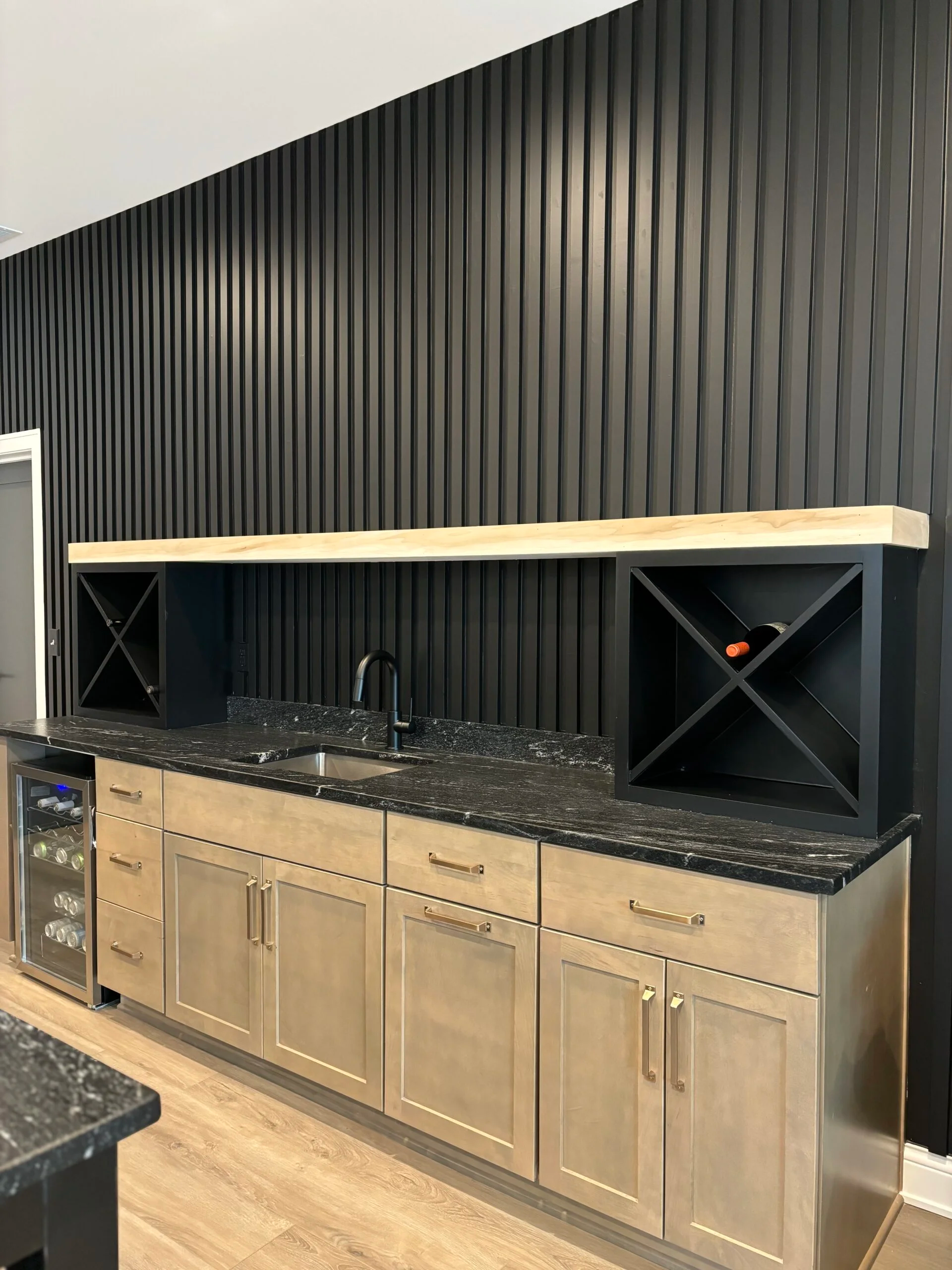 Home office accent wall with diagonal slate blue-gray trim built by Radford Woodworks
