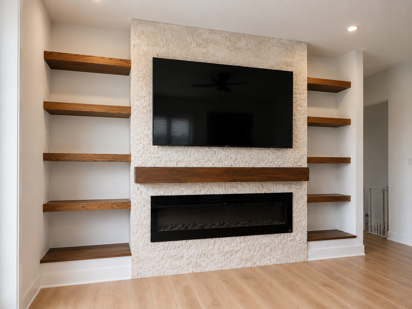 Custom Indiana electric fireplace wall with floor-to-ceiling Turkish marble ledger stone and a recessed Touchstone fire box