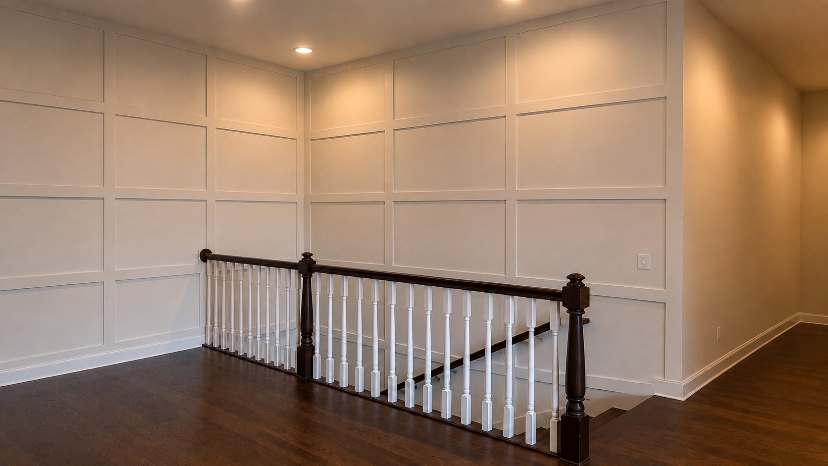 Indiana grid walls: full-height painted batten grid wall above a dark stained stair railing with white balusters in a central Indiana home by Radford Woodworks