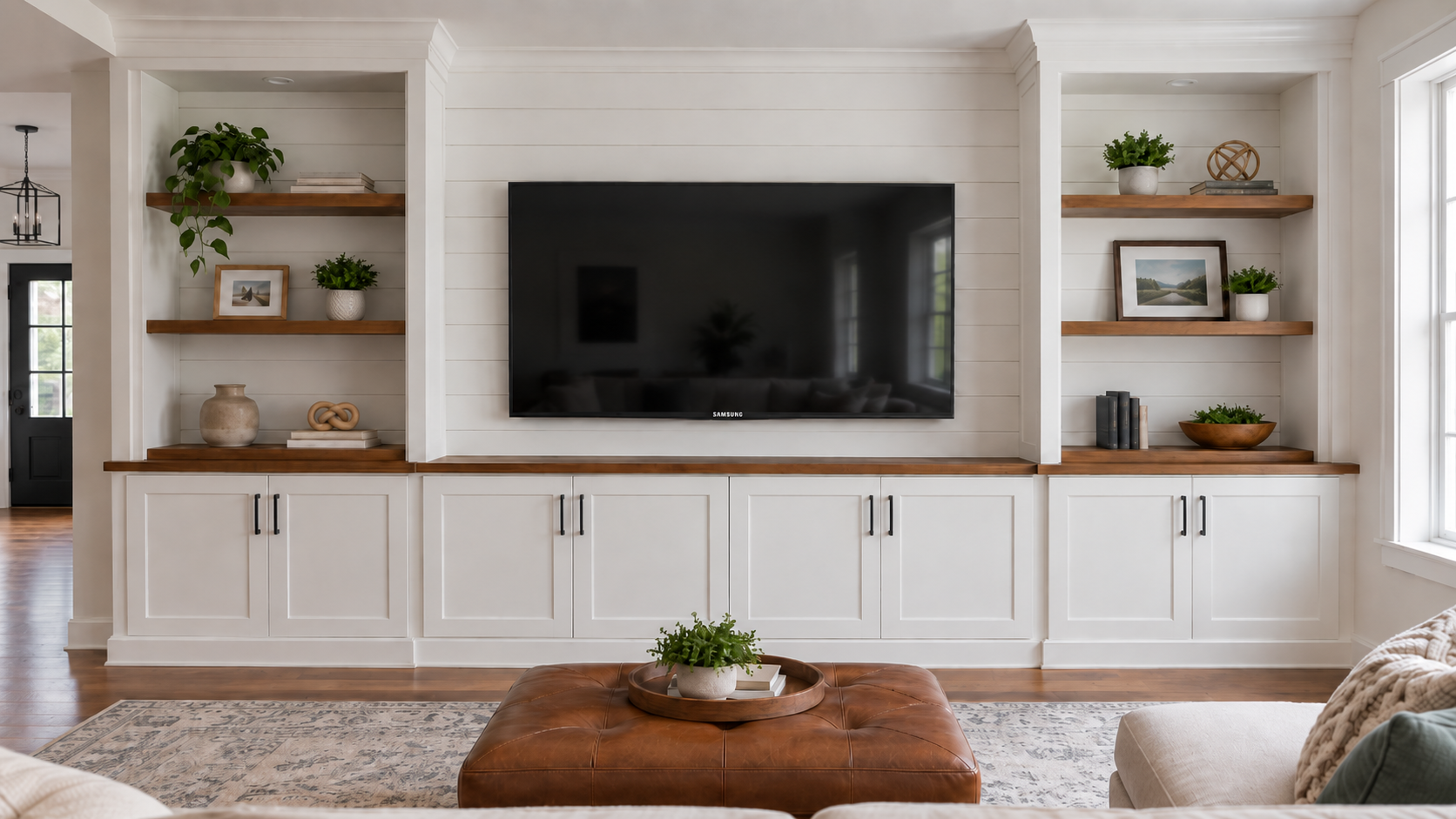 Custom Indiana TV walls built by Radford Woodworks with a shiplap entertainment center and built-in cabinets